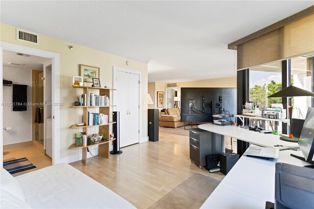 2000 Towerside Ter Unit 710, Miami, FL 33138 - home office with light wood-style floors