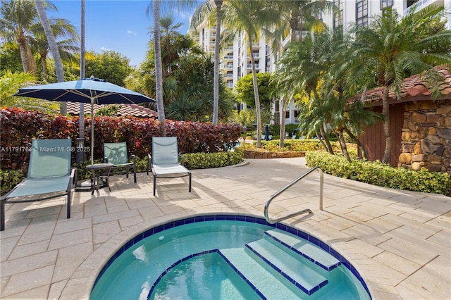 2000 Towerside Ter Unit 710, Miami, FL 33138 - view of swimming pool featuring a hot tub and a patio