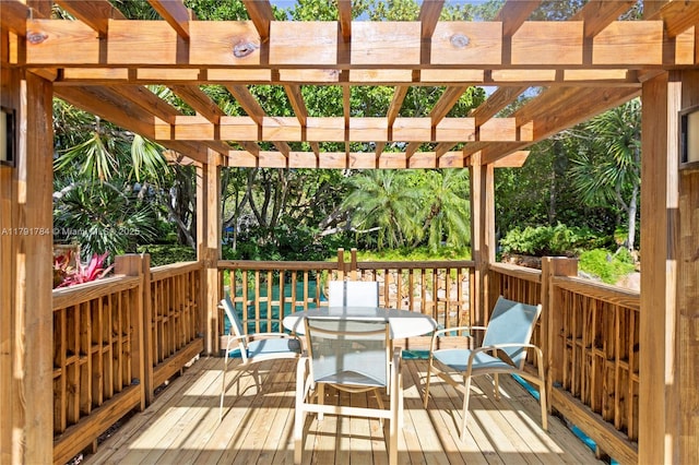 wooden deck featuring a pergola and outdoor dining area