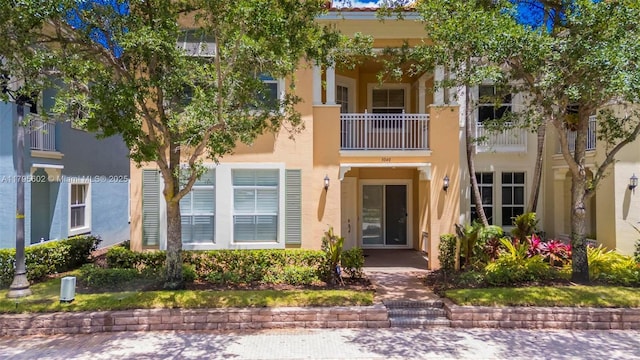 3040 NW 126th Ave, Sunrise, FL 33323 - view of front of house featuring stucco siding and a balcony
