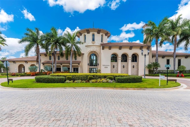 3040 NW 126th Ave, Sunrise, FL 33323 - view of front of home with a tile roof, stucco siding, and curved driveway