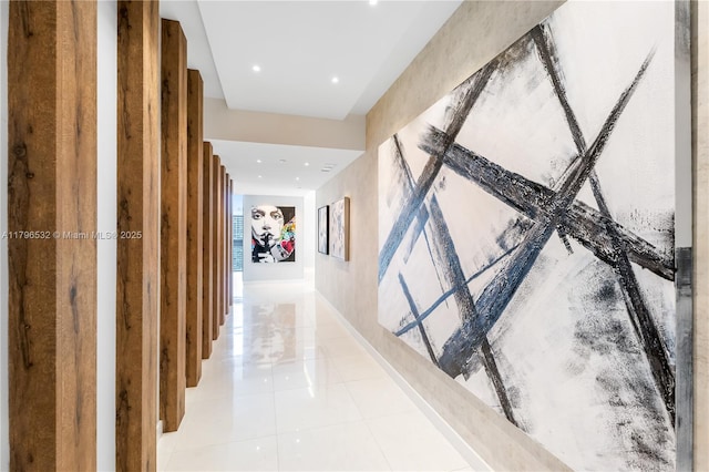 hallway with light tile patterned floors and recessed lighting