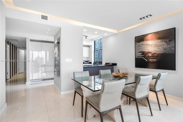 dining space featuring light tile patterned floors, visible vents, baseboards, and recessed lighting