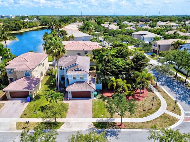 bird's eye view featuring a water view and a residential view