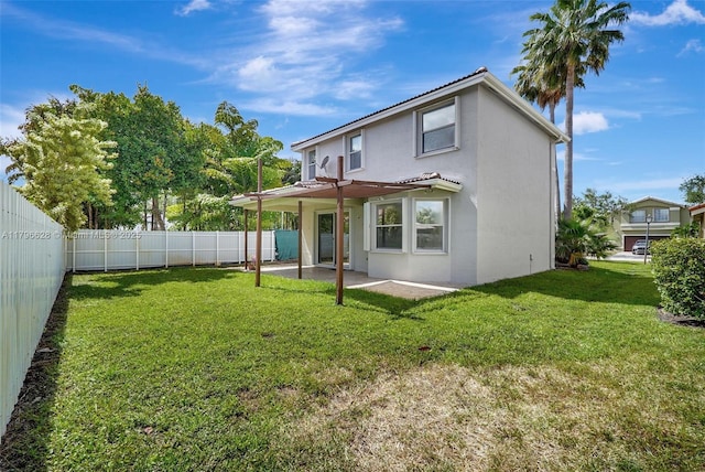 back of property featuring a fenced backyard, a patio area, stucco siding, and a lawn