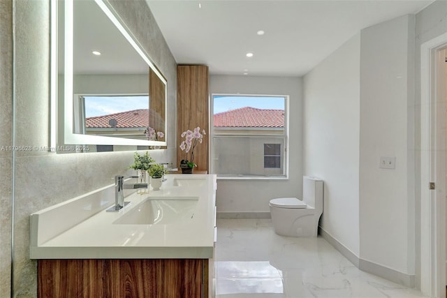 16276 SW 29th St, Miramar, FL 33027 - full bath featuring marble tiled flooring, double vanity, toilet, recessed lighting, and baseboards