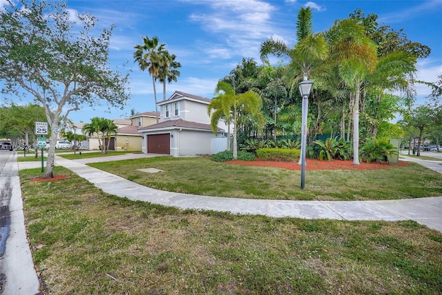 16276 SW 29th St, Miramar, FL 33027 - view of front of house with driveway, a garage, a front lawn, and stucco siding