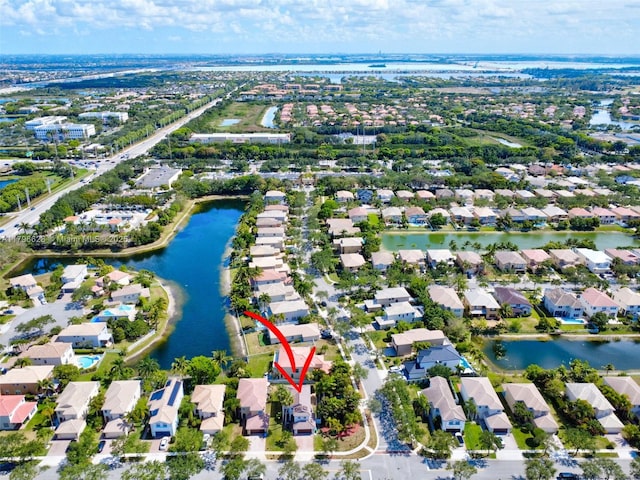 aerial view with a water view and a residential view