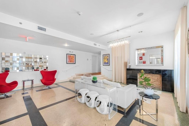 1300 Pennsylvania Ave Unit 104, Miami Beach, FL 33139 - living room featuring baseboards, a chandelier, visible vents, and speckled floor