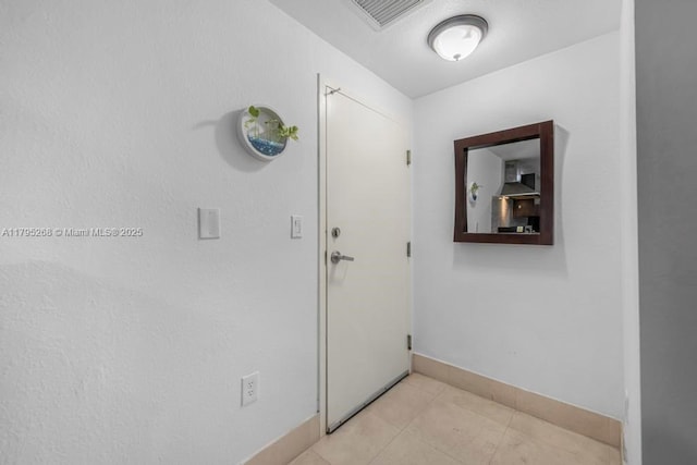 1300 Pennsylvania Ave Unit 104, Miami Beach, FL 33139 - hall with baseboards, visible vents, and light tile patterned flooring