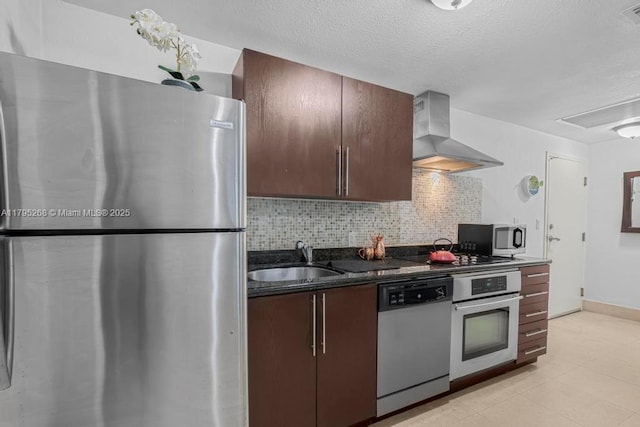 1300 Pennsylvania Ave Unit 104, Miami Beach, FL 33139 - kitchen with a sink, wall chimney exhaust hood, visible vents, appliances with stainless steel finishes, and decorative backsplash