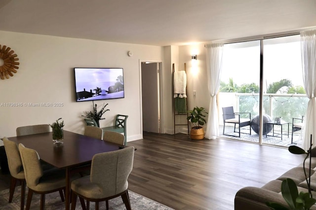 dining area featuring wood finished floors and baseboards