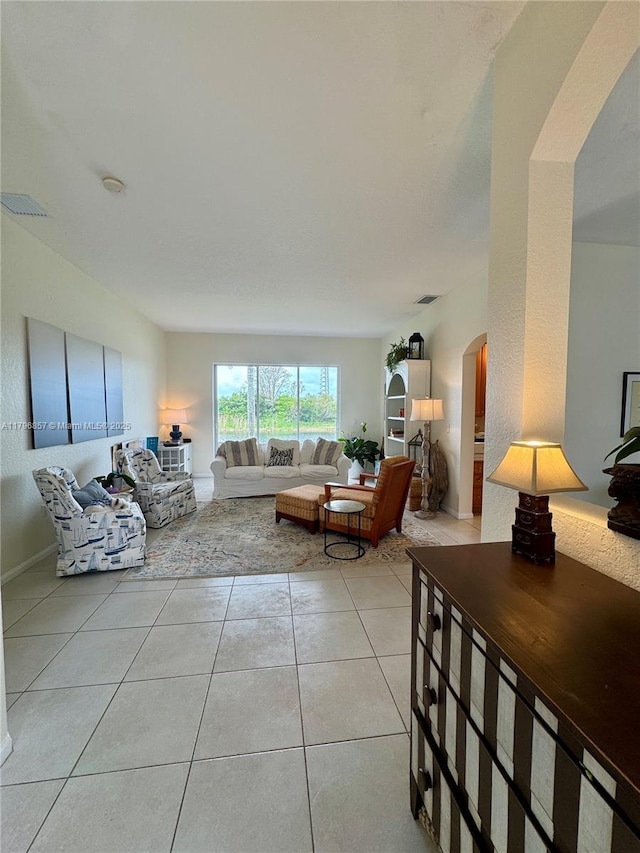 16724 NW 8th St, Pembroke Pines, FL 33028 - living room featuring light tile patterned flooring, arched walkways, and visible vents