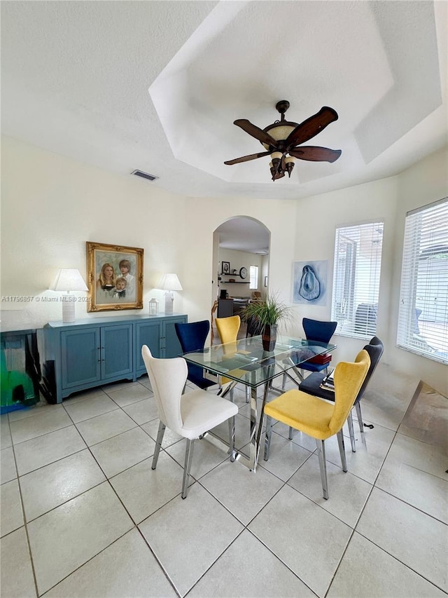 16724 NW 8th St, Pembroke Pines, FL 33028 - dining space featuring arched walkways, a raised ceiling, ceiling fan, and visible vents