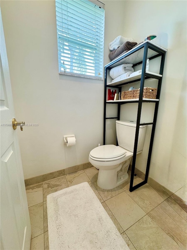 16724 NW 8th St, Pembroke Pines, FL 33028 - half bath featuring toilet, tile patterned flooring, and baseboards