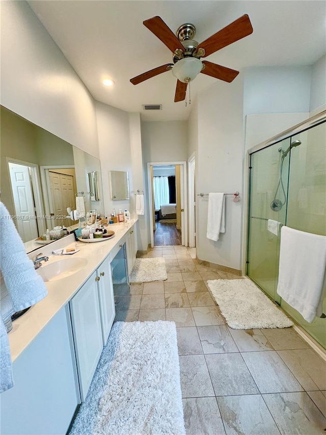 16724 NW 8th St, Pembroke Pines, FL 33028 - full bathroom with double vanity, a ceiling fan, a sink, visible vents, and a shower stall