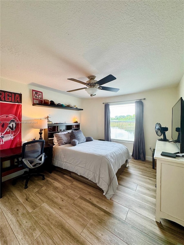 16724 NW 8th St, Pembroke Pines, FL 33028 - bedroom with a textured ceiling, wood finished floors, and a ceiling fan