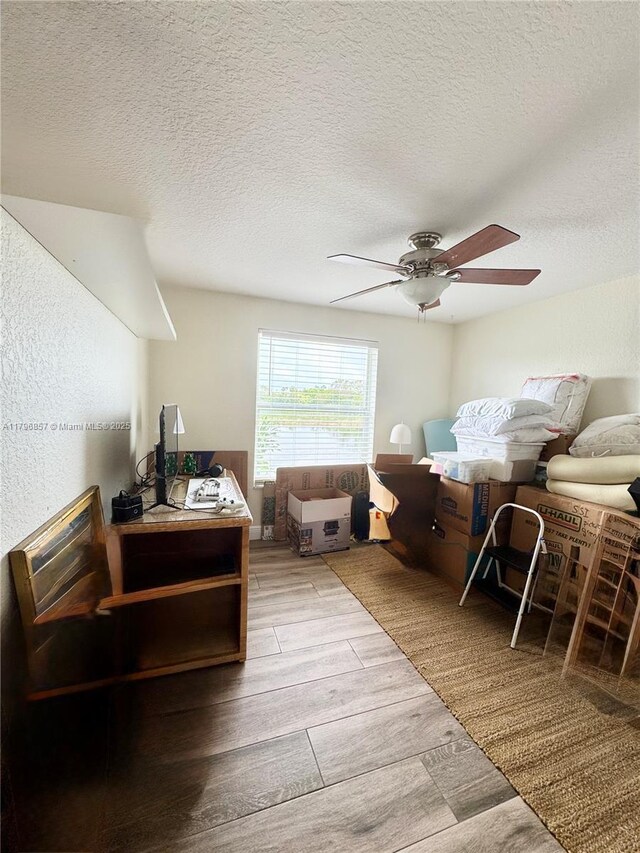 16724 NW 8th St, Pembroke Pines, FL 33028 - interior space featuring ceiling fan, a textured ceiling, and wood finish floors