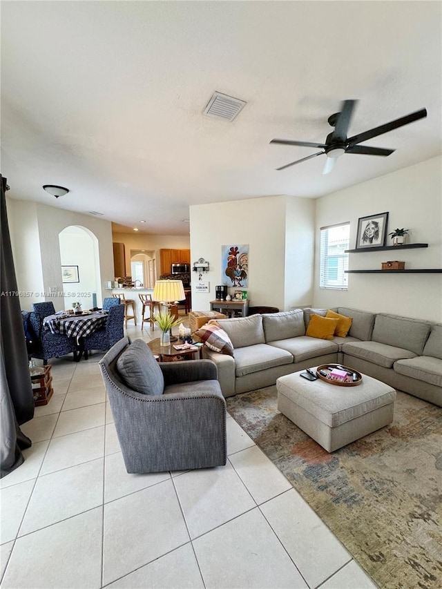16724 NW 8th St, Pembroke Pines, FL 33028 - living room featuring arched walkways, light tile patterned floors, visible vents, and a ceiling fan