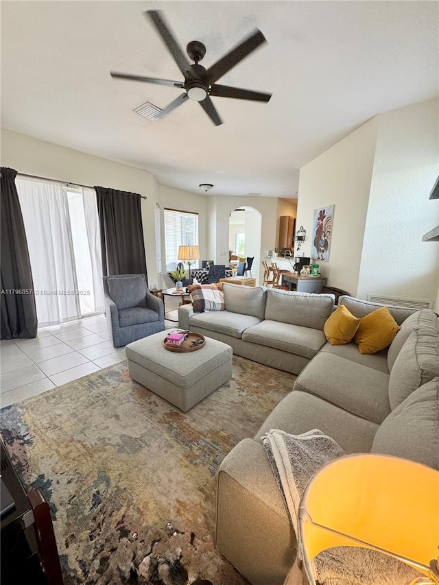 16724 NW 8th St, Pembroke Pines, FL 33028 - living room with arched walkways, a ceiling fan, and light tile patterned floors