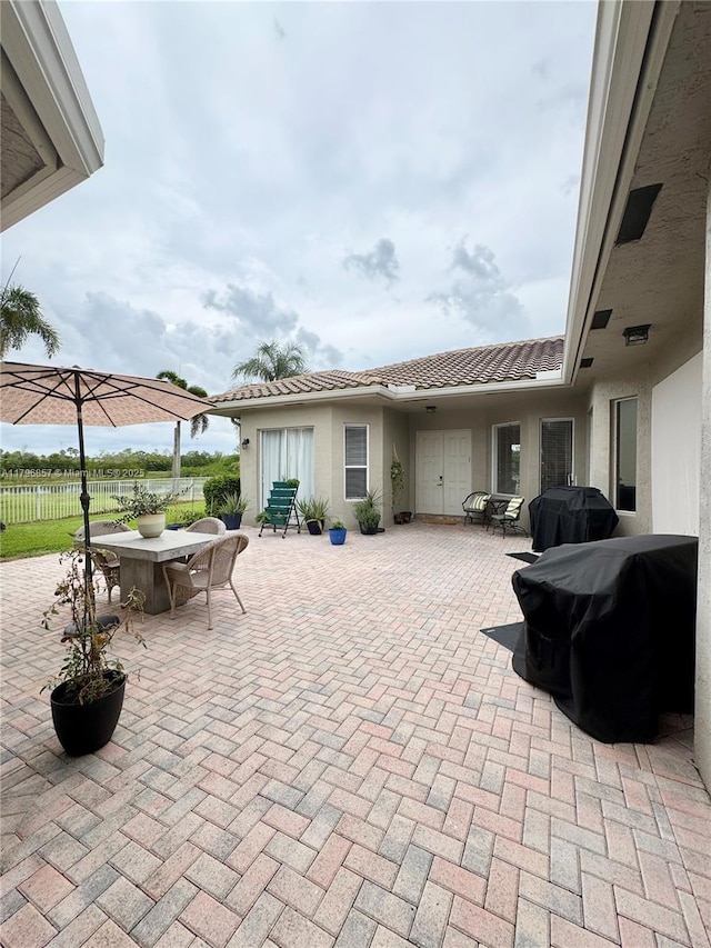 16724 NW 8th St, Pembroke Pines, FL 33028 - view of patio / terrace with area for grilling, outdoor dining area, and fence