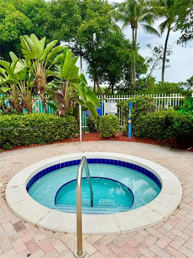 16724 NW 8th St, Pembroke Pines, FL 33028 - view of swimming pool featuring a community hot tub and fence