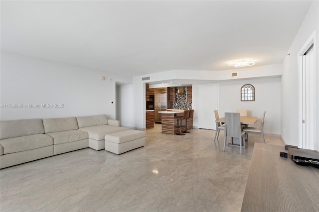 living area with light marble finish flooring