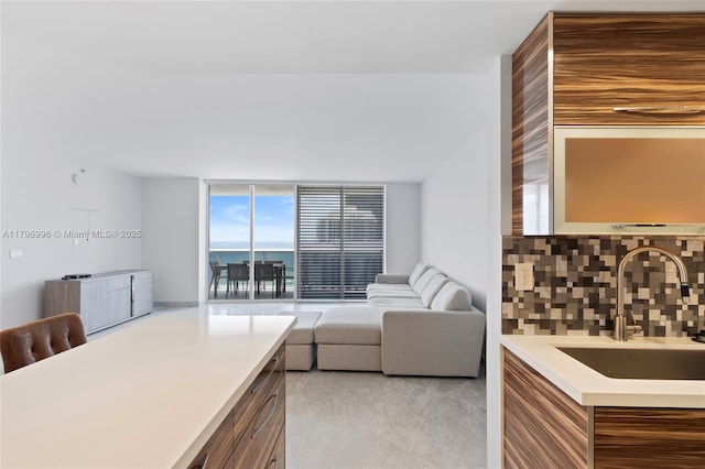 bedroom featuring a sink and expansive windows