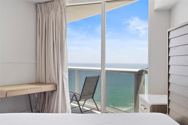 bedroom featuring a water view