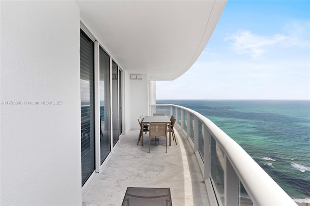 balcony featuring a water view