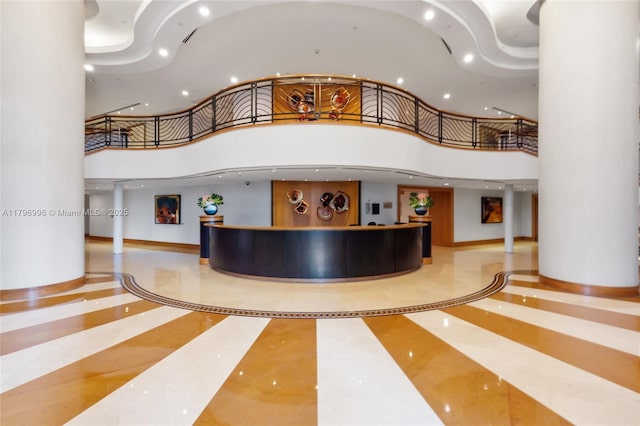 reception area featuring a high ceiling and recessed lighting