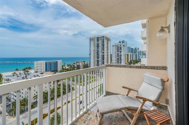 balcony with a view of city and a water view