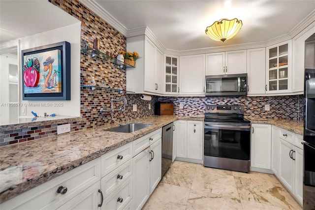 kitchen with appliances with stainless steel finishes, a sink, backsplash, light stone counters, and white cabinets