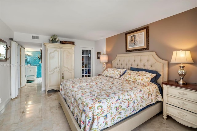 bedroom featuring light marble finish floors