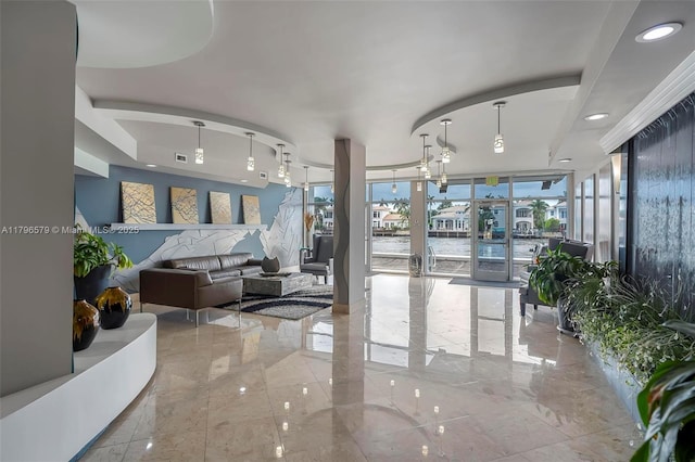 building lobby featuring a water view