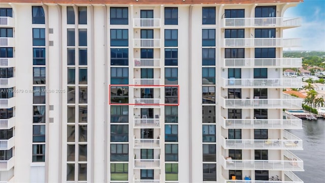 view of apartment building / complex featuring a water view