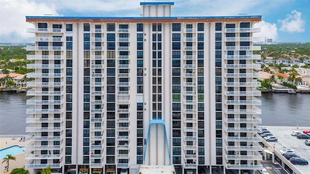 view of apartment building / complex with a water view