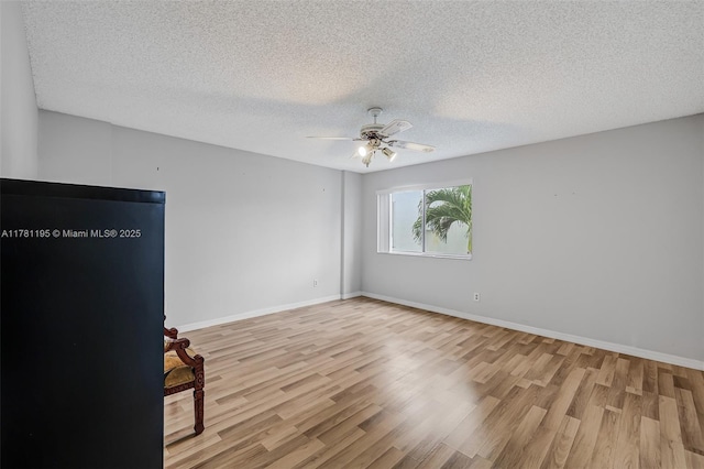 6698 N 10th Ave N Unit 218, Lake Worth, FL 33467 - spare room with a textured ceiling, wood finished floors, and ceiling fan