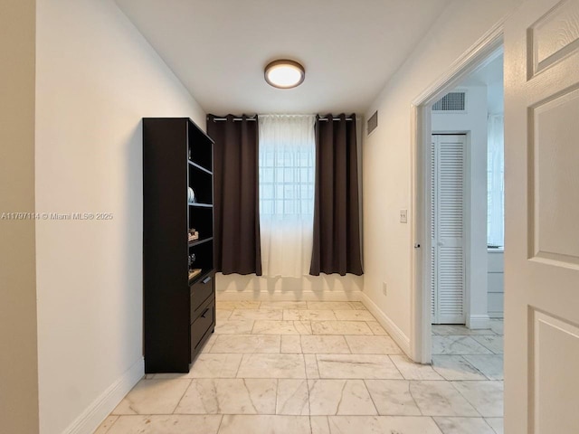 1526 Pennsylvania Ave Unit 20, Miami Beach, FL 33139 - hallway featuring marble finish floor, baseboards, and visible vents