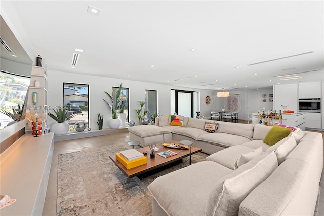 2020 NE 121st Rd, North Miami, FL 33181 - living room with finished concrete floors and recessed lighting