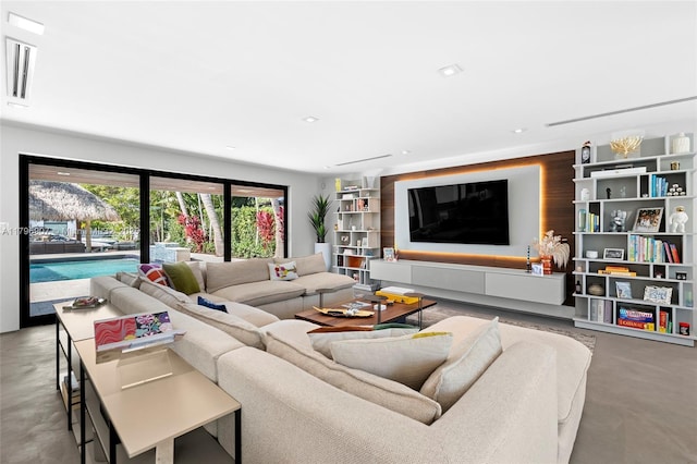 2020 NE 121st Rd, North Miami, FL 33181 - living area with visible vents, finished concrete flooring, and recessed lighting