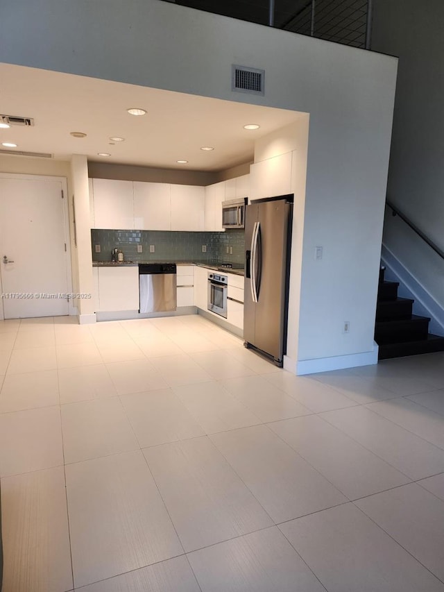 kitchen featuring white cabinets, visible vents, and appliances with stainless steel finishes