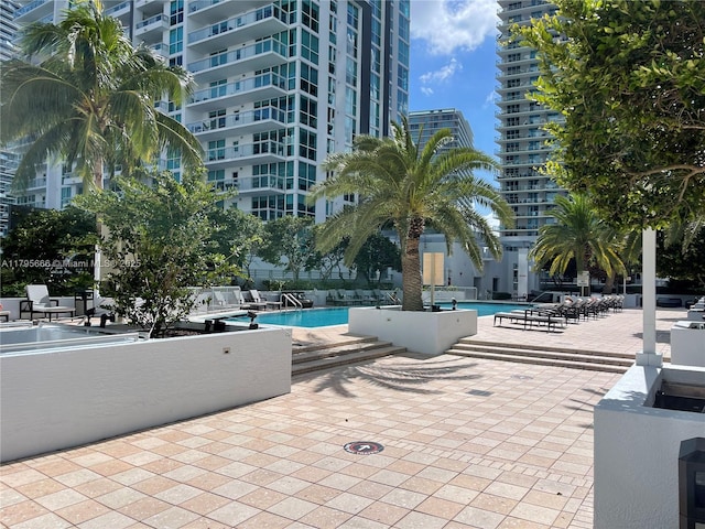 community pool featuring a patio area