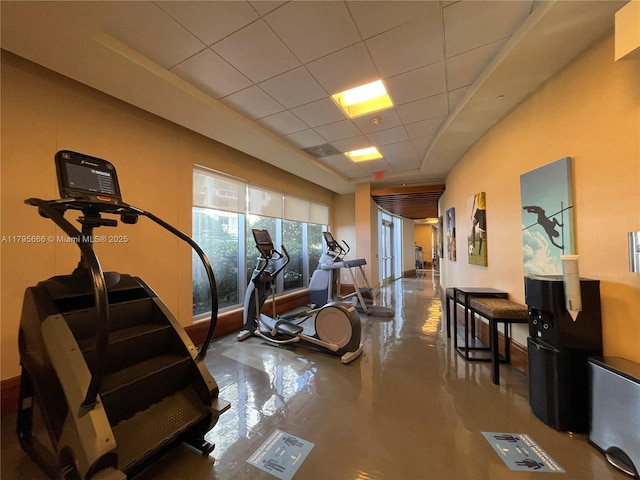 exercise room with a drop ceiling