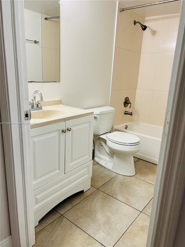 bathroom with toilet, tile patterned floors, vanity, and shower / bath combination