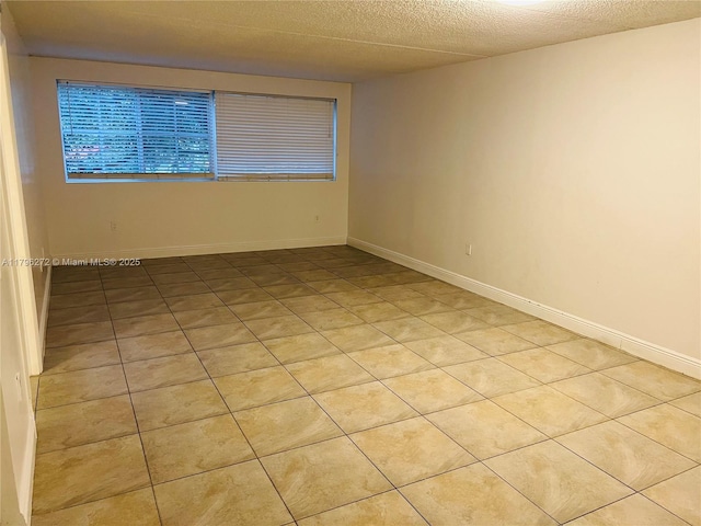 empty room featuring baseboards
