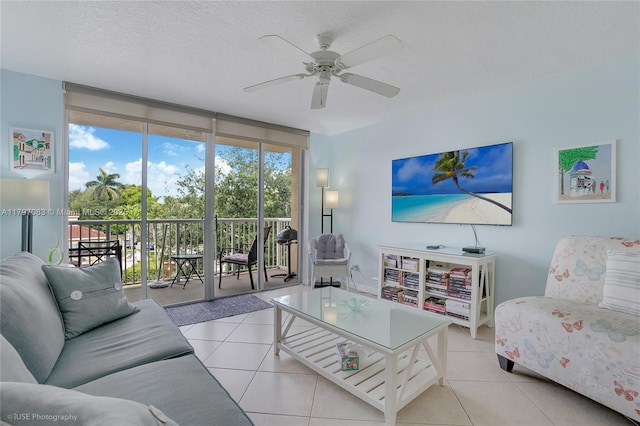 519 E Sheridan St Unit 3052, Dania Beach, FL 33004 - living room featuring ceiling fan, a textured ceiling, and tile patterned floors