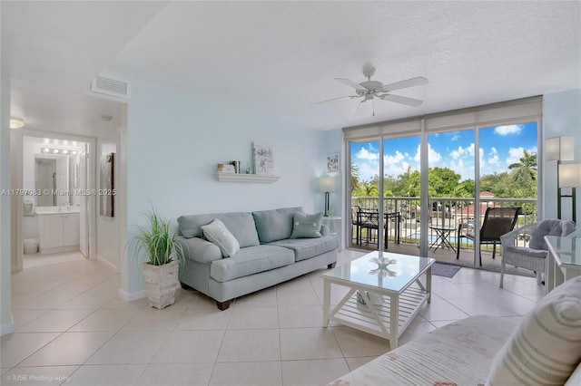 519 E Sheridan St Unit 3052, Dania Beach, FL 33004 - living room with baseboards, a ceiling fan, visible vents, and tile patterned floors