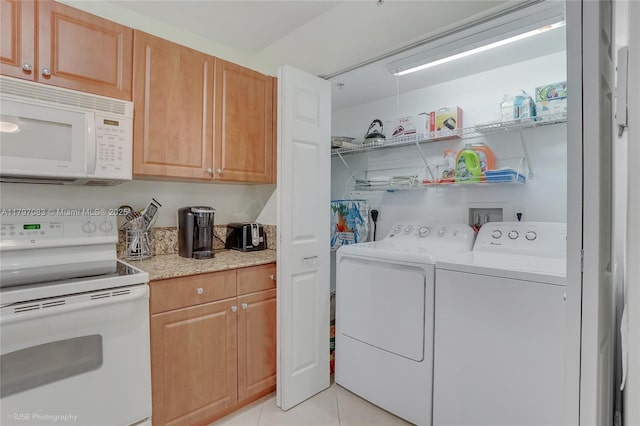 519 E Sheridan St Unit 3052, Dania Beach, FL 33004 - laundry area featuring washer and dryer, laundry area, and light tile patterned floors