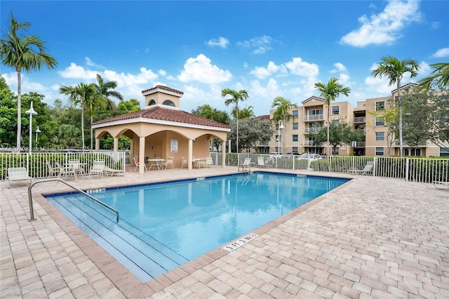 519 E Sheridan St Unit 3052, Dania Beach, FL 33004 - community pool featuring a patio and fence